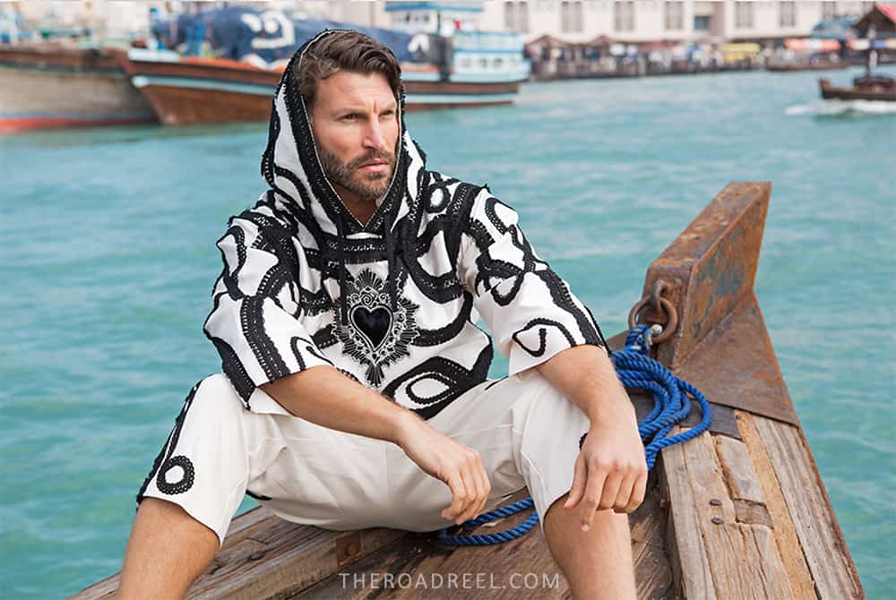 daytime traditional shoot abra boat across Dubai creek,