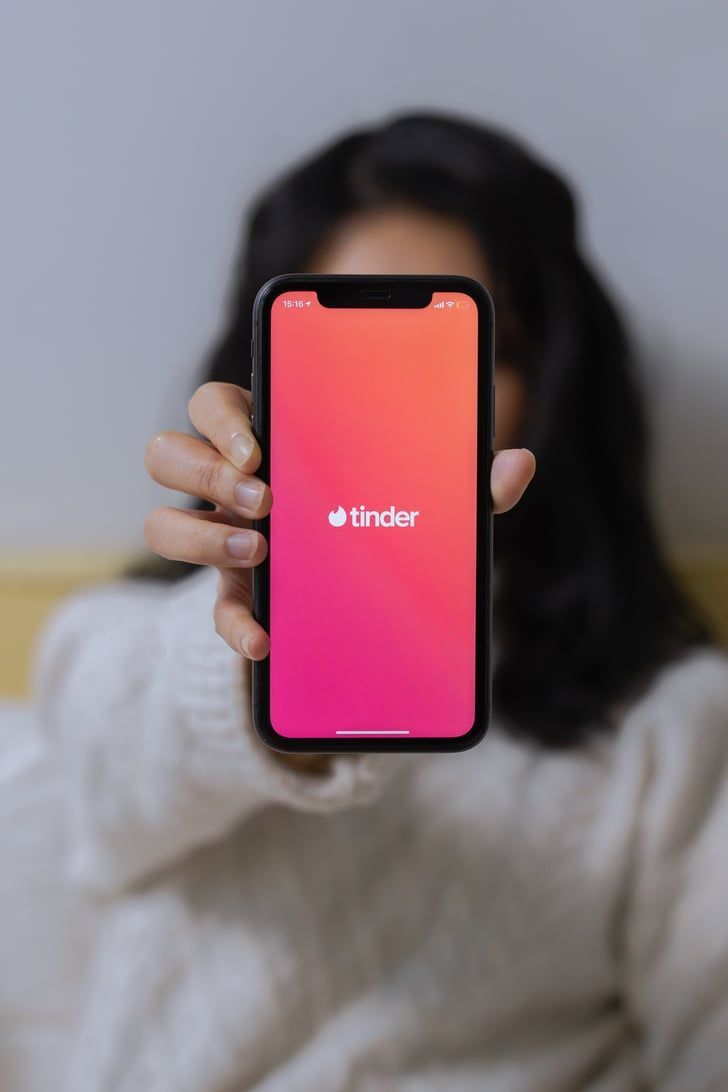 Tinder dating app logo on smartphone screen - popular swipe-based online dating app