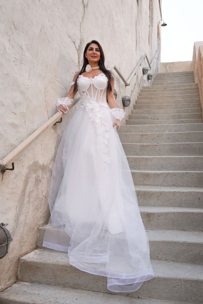 a bride on traditional neighborhood stairs in dubai