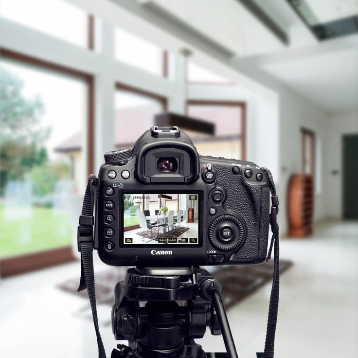 Real estate photographer capturing interior photos of a property