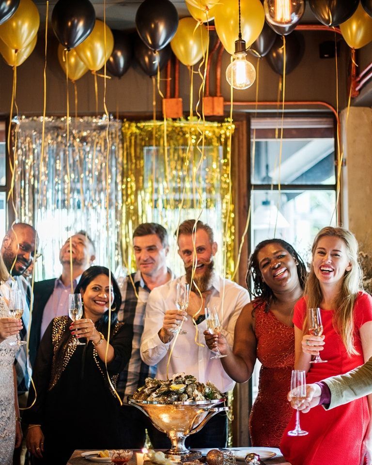 Birthday party photographer in Dubai capturing guests celebrating under balloon decorations