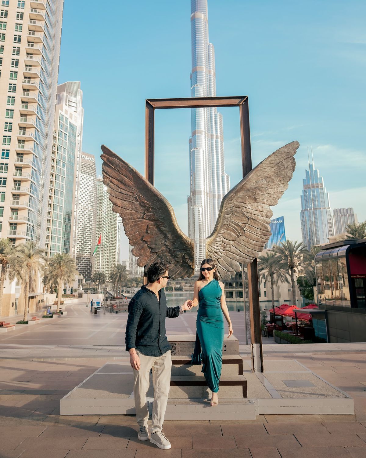 Couple holding hands during a proposal photography session in Dubai