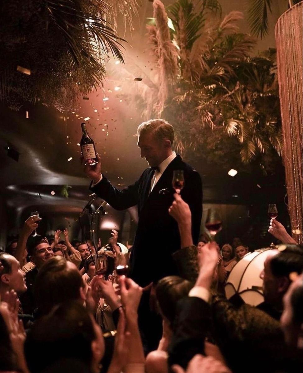 Private party photographer in Dubai capturing a guest holding champagne