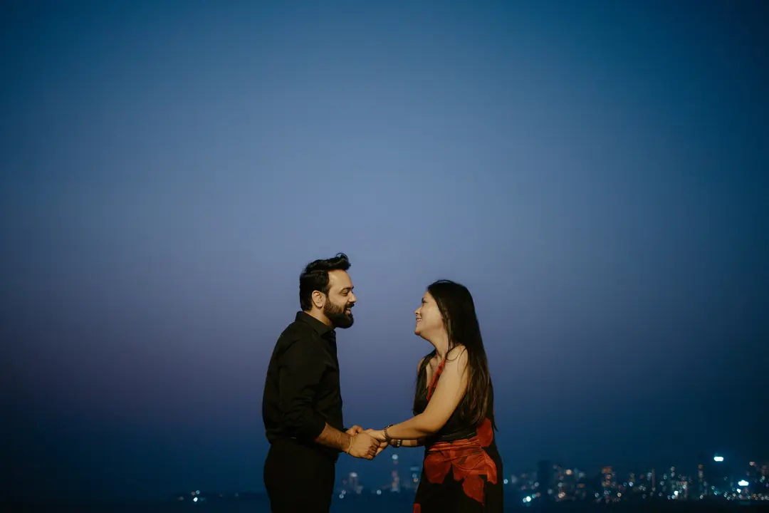 Couple holding hands during a proposal photoshoot in Dubai